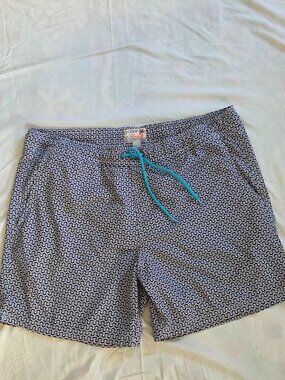 J.Crew swim briefs featuring a geometric maze-like print and a bright-colored ad